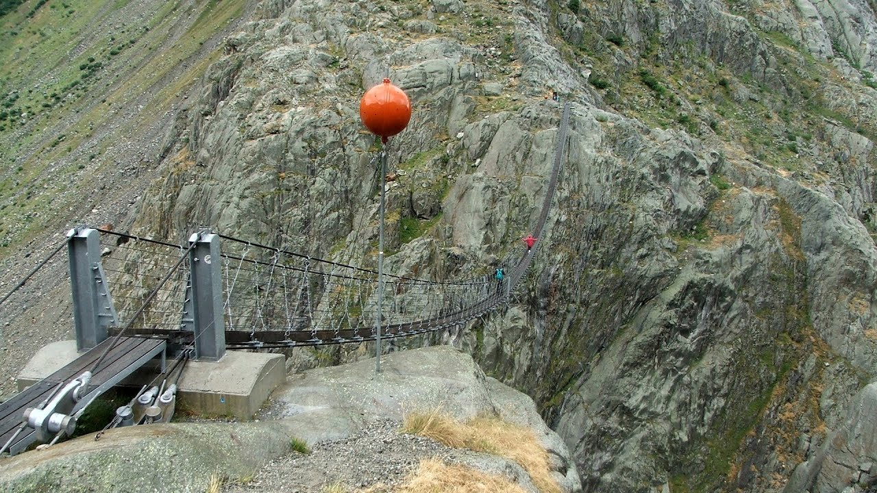 Trift valley, bridge, lake and glacier - Gadmen, Switzerland - video